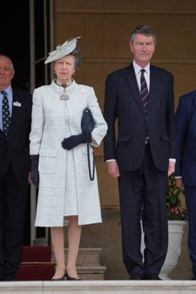 Royal garden party with Princess Anne at Buckingham Palace in London, UK, 19 May 2026 The Princess Royal and her husband Vice Admiral Sir Timothy Laurence (right) stand at the top of the Garden steps, as the national anthem is played, before the start of The Not Forgotten Association Annual Garden Party at Buckingham Palace, London. Picture date: Tuesday May 19, 2026., Credit:Yui Mok PA ROTA - B68 Avalon United Kingdom, London  Copyright: xYuixMokx xPAxROTAx-xB68x xAvalonx 1100587660