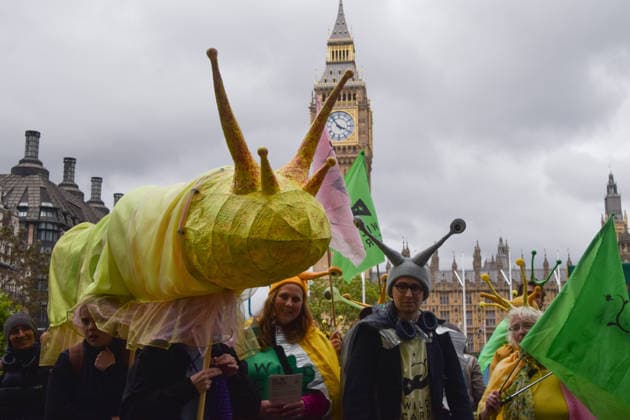 May 19, 2026, London, England, United Kingdom: Activists hold a large model slug in Parliament Square during the march for ancient woodland restoration. Organised by the campaign group Wild Card, the protesters marched to the Department for Environment, Food and Rural Affairs (DEFRA) calling on the government to restore so-called ghost woods , remains of ancient ecosystems buried beneath timber plantations. London United Kingdom  - ZUMAv130 20260519_zip_v130_099 Copyright: xVukxValcicx