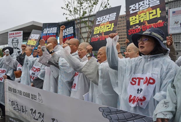 Buddhist monks, activists call for peace in the Middle East Monks of the Jogye Order and peace activists perform 108 prostrations in front of the US Embassy in Seoul, South Korea, on May 20, 2026. The demonstrators utilized the traditional Buddhist ritual to pray for an immediate end to the conflict in the Middle East and to advocate for global peace. Seoul South Korea  Copyright: xMatrixxImagesx xLeexSang-hoonx