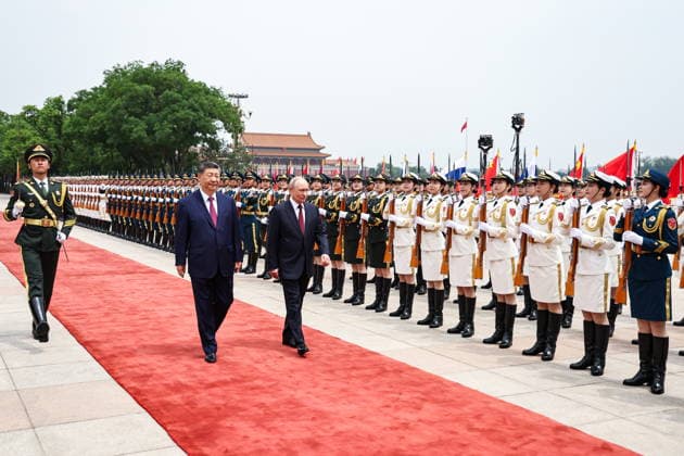 CHINA, BEIJING - MAY 20, 2026: Xi Jinping, President of China, and his counterpart Vladimir Putin (L-R centre) of Russia walk honour guards during a welcoming ceremony in Tiananmen Square. Putin s official visit marks 25 years since the 2001 Treaty of Good Neighbourliness and Friendly Cooperation between Russia and China. Alexander Kazakov Russian Presidential Press and Information Office TASS  92770967
