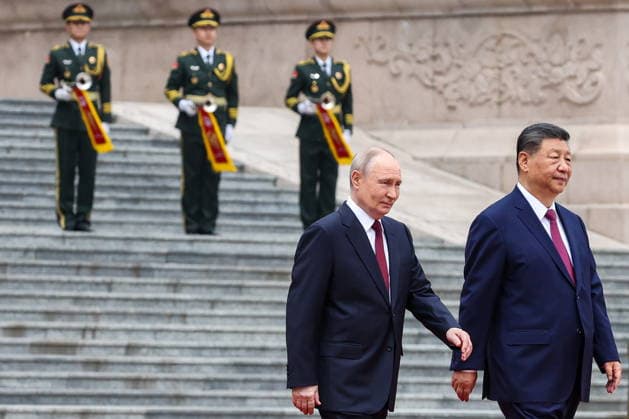 CHINA, BEIJING - MAY 20, 2026: Vladimir Putin (L), President of Russia, and his counterpart Xi Jinping of China emerge during a welcoming ceremony in Tiananmen Square. Putin s official visit marks 25 years since the 2001 Treaty of Good Neighbourliness and Friendly Cooperation between Russia and China. Alexander Kazakov Russian Presidential Press and Information Office TASS  92771016