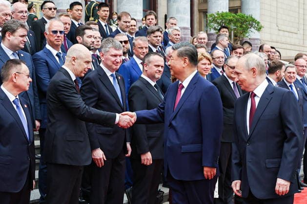 CHINA, BEIJING - MAY 20, 2026: Vladimir Putin, President of Russia, his counterpart Xi Jinping (R-L front) of China, Russia s Construction, Housing and Utilities Minister Irek Faizullin, Finance Minister Anton Siluanov, Economic Development Minister Maxim Reshetnikov and Transoport Minister Andrei Nikitin (L-R front) shake hands during a welcoming ceremony in Tiananmen Square. Putin s official visit marks 25 years since the 2001 Treaty of Good Neighbourliness and Friendly Cooperation between Russia and China. Alexander Kazakov Russian Presidential Press and Information Office TASS  92771110