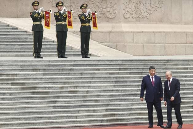 China-Russia summit Russian President Vladimir Putin (front, R) attends a welcoming ceremony with Chinese President Xi Jinping (front, L) at the Great Hall of the People in Beijing ahead of their summit meeting on May 20, 2026. (Pool photo)  A14AA0005587387P