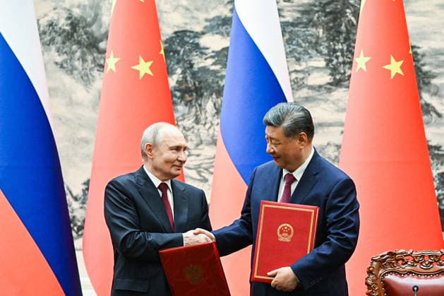 CHINA, BEIJING - MAY 20, 2026: Vladimir Putin (L), President of Russia, and his counterpart Xi Jinping of China sign joint documents following bilateral talks at the Great Hall of the People. Putin s official visit marks 25 years since the 2001 Treaty of Good Neighbourliness and Friendly Cooperation between Russia and China. Kristina Solovyova POOL TASS  92773582