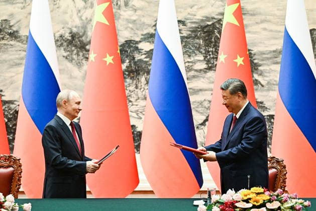 CHINA, BEIJING - MAY 20, 2026: Vladimir Putin (L), President of Russia, and his counterpart Xi Jinping of China sign joint documents following bilateral talks at the Great Hall of the People. Putin s official visit marks 25 years since the 2001 Treaty of Good Neighbourliness and Friendly Cooperation between Russia and China. Kristina Solovyova POOL TASS  92773585