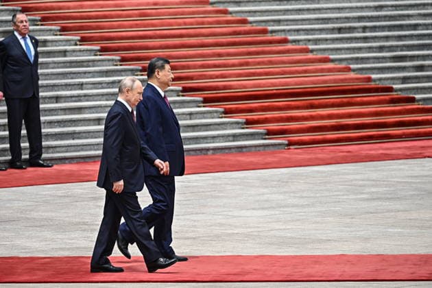 CHINA, BEIJING - MAY 20, 2026: Vladimir Putin (L), President of Russia, and his counterpart Xi Jinping of China attend a welcoming ceremony in Tiananmen Square, with Russia s Foreign Minister Sergei Lavrov in the background. Putin s official visit marks 25 years since the 2001 Treaty of Good Neighbourliness and Friendly Cooperation between Russia and China. Kristina Solovyova POOL TASS  92769728