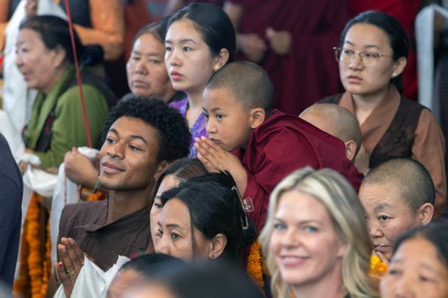 May 20, 2026, Palampur, Dharamshala, India: A novice monk and tibetan flowers watching Tibetan spiritual Leader the Dalai Lama (not in picture) leaving the temple after end of a long life prayer offered to him by Central Dokham Chushi Gangdrug and Himalayan Buddhist Cultural Association at the Main Tibetan Temple in Mcleodganj, Dharamshala ..NOTE: EDITORIAL USE ONLY. Palampur India - ZUMAb235 20260520_zip_b235_009 Copyright: xShaileshxBhatnagarx