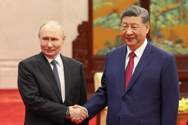 CHINA, BEIJING - MAY 20, 2026: Vladimir Putin (L), President of Russia, and his counterpart Xi Jinping of China shake hands during an informal tea meeting at the Great Hall of the People. Putin s official visit marks 25 years since the 2001 Treaty of Good Neighbourliness and Friendly Cooperation between Russia and China. Alexander Kazakov Russian Presidential Press and Information Office TASS  92785217
