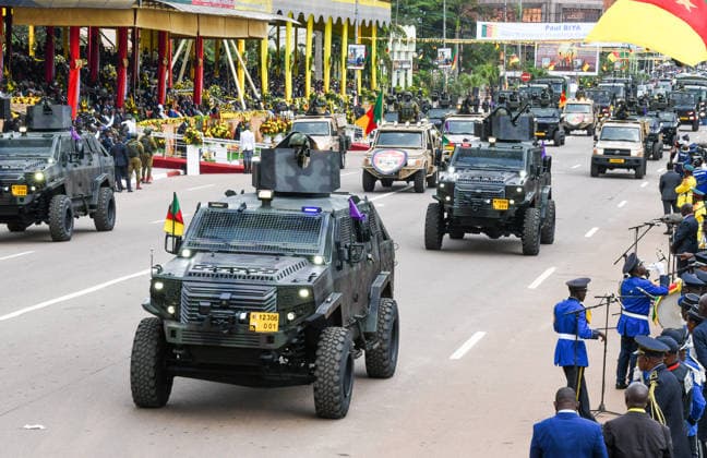 (260520) -- YAOUNDE, May 20, 2026 -- Military vehicles parade during the National Day celebrations in Yaounde, Cameroon, on May 20, 2026. Cameroon on Wednesday marked the 54th anniversary of its National Day with military and civilian parades held across the country. ) CAMEROON-54TH NATIONAL DAY-CELEBRATIONS Kepseu 