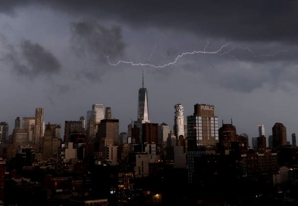 Storm clouds and dark skies move in behind One World Trade Center and Manhattan Skyline bringing thunderstorms and lightning in the early evening on Wednesday, May 20, 2026 in New York City.  NYP20260520132 JOHNxANGELILLO