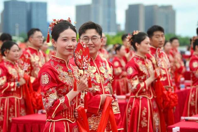 HEFEI, CHINA - MAY 20: Newly-wed couples in traditional Chinese-style clothing attend a group wedding ceremony during 520 I Love You Day on May 20, 2026 in Hefei, Anhui Province of China. Chinese people celebrate 520 I Love You Day as 520 sounds like I love you in Chinese.  Copyright: xChinaxNewsxServicex 111642851339