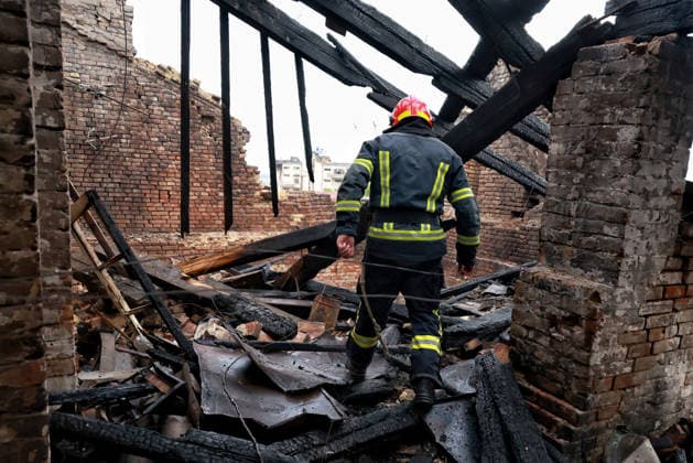 RECORD DATE NOT STATED A firefighter works to eliminate the aftermath of a Russian drone attack in Odesa, Ukraine, on May 18, 2026. As a result of a massive overnight attack by Russian strike drones, several residential buildings in the Prymorskyi and Kyivskyi districts sustained significant damage. Roofs of three-storey buildings were destroyed, while a one-storey house was ruined in another area. Buildings of a city lyceum and a kindergarten were also damaged. Two people, an 11-year-old boy and a 59-year-old man, were injured (Photo by Nina Liashonok Ukrinform) Russian drone attack on Odesa leaves people injured  Copyright: xNinaxLiashonokx
