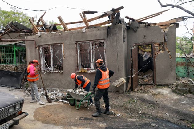 RECORD DATE NOT STATED Municipal workers deal with the aftermath of a Russian drone attack in Odesa, Ukraine, on May 18, 2026. As a result of a massive overnight attack by Russian strike drones, several residential buildings in the Prymorskyi and Kyivskyi districts sustained significant damage. Roofs of three-storey buildings were destroyed, while a one-storey house was ruined in another area. Buildings of a city lyceum and a kindergarten were also damaged. Two people, an 11-year-old boy and a 59-year-old man, were injured (Photo by Nina Liashonok Ukrinform) Russian drone attack on Odesa leaves people injured  Copyright: xNinaxLiashonokx