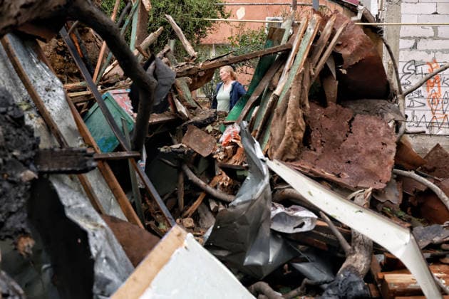 RECORD DATE NOT STATED A woman stands near a private residential house destroyed as a result of a Russian drone attack in Odesa, Ukraine, on May 20, 2026. During the night of May 20, the city came under a massive attack by Russian strike drones. The attack caused destruction of residential buildings, fires at commercial facilities, and damage to critical infrastructure. One civilian was injured (Photo by Nina Liashonok Ukrinform) Aftermath of overnight Shahed drone attack on Odesa  Copyright: xNinaxLiashonokx