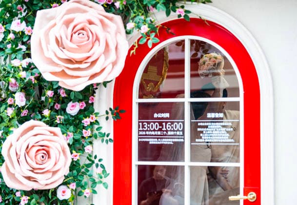 BEIJING, CHINA - MAY 20: A newly-wed couple pose for a photo at the marriage registration office during 520 I Love You Day on May 20, 2026 in Beijing, China. Chinese people celebrate 520 I Love You Day as 520 sounds like I love you in Chinese.  Copyright: xChinaxNewsxServicex 111642862045