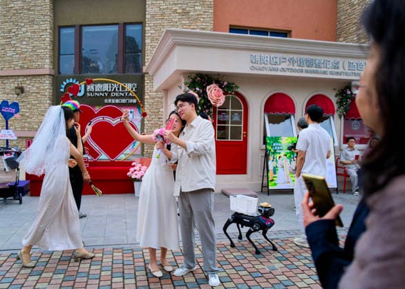 BEIJING, CHINA - MAY 20: A newly-wed couple take a selfie at the marriage registration office during 520 I Love You Day on May 20, 2026 in Beijing, China. Chinese people celebrate 520 I Love You Day as 520 sounds like I love you in Chinese.  Copyright: xVCGx 111642848278