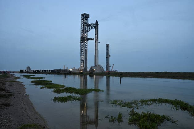 The SpaceX Super Heavy Booster and Starship spacecraft stand on Orbital Launch Pad 2 at Starbase, Texas during the early evening on Wednesday May 20, 2026. SpaceX remains on schedule so far for a launch attempt on Thursday, May 21. SpaceX is monitoring all the upgrades made on the new pad, the booster and Starship. The launch window will open at 5:30 PM.  SBP20260520006 JOExMARINO
