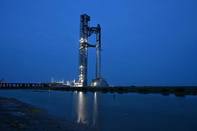 The SpaceX Super Heavy Booster and Starship spacecraft stand on Orbital Launch Pad 2 at Starbase, Texas during the early evening on Wednesday May 20, 2026. SpaceX remains on schedule so far for a launch attempt on Thursday, May 21. SpaceX is monitoring all the upgrades made on the new pad, the booster and Starship. The launch window will open at 5:30 PM.  SBP20260520008 JOExMARINO