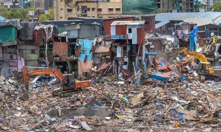 MUMBAI, INDIA - MAY 20: JCB machines in action on second day of an anti-encroachment drive on railway land at Garib Nagar slum in Bandra East on May 20, 2026 in Mumbai, India. (Photo by Satish Bate Hindustan Times) Second Day Of Demolition Drive At Bandra Garib Nagar