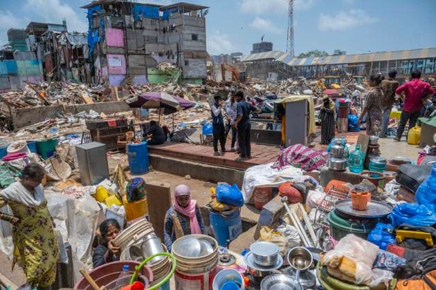 MUMBAI, INDIA - MAY 20: Residents of the Garib Nagar slum in Bandra East salvage their belongings on second day of an anti-encroachment drive on railway land on May 20, 2026 in Mumbai, India. (Photo by Satish Bate Hindustan Times) Second Day Of Demolition Drive At Bandra Garib Nagar