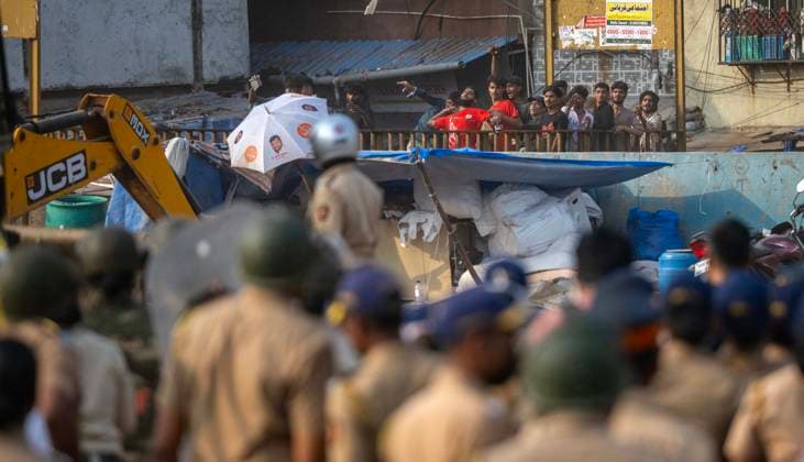 MUMBAI, INDIA - MAY 20: Residents of the Garib Nagar slum in Bandra East pelt stones at police during the second day of an anti-encroachment drive on railway land on May 20, 2026 in Mumbai, India. (Photo by Satish Bate Hindustan Times) Second Day Of Demolition Drive At Bandra Garib Nagar