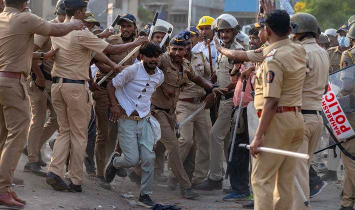 MUMBAI, INDIA - MAY 20: Police detain residents after clash on the second day of an anti-encroachment drive at Garib Nagar slum on railway land on May 20, 2026 in Mumbai, India. (Photo by Satish Bate Hindustan Times) Second Day Of Demolition Drive At Bandra Garib Nagar