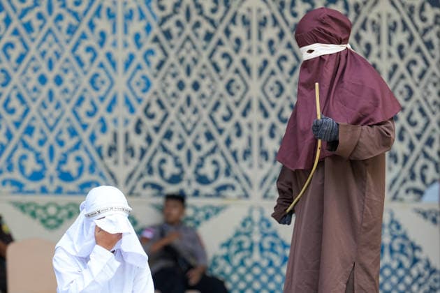 May 21, 2026, Banda Aceh, Aceh, Indonesia: A woman convicted of adultery and adultery was sentenced to 100 lashes in Banda Aceh, Aceh Province, Indonesia, on Thursday. The caning was imposed after she was found guilty of violating Aceh s Sharia law. The public caning served as a lesson and transparency in the implementation of punishment, guaranteed by the Aceh Qanun (Aceh Law), which was passed in 2014. Banda Aceh Indonesia  - ZUMAi115 20260521_zip_i115_035 Copyright: xMuhammadxIqbalx