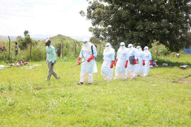 (260521) -- BUNIA, May 21, 2026 -- Medical workers conduct disinfection before the burial of a suspected Ebola victim in Rwampara town, near Bunia of Ituri Province, the Democratic Republic of the Congo, on May 21, 2026. The outbreak, initially reported in Ituri Province, has now affected North Kivu and South Kivu, while two confirmed cases have also been reported in the neighboring country of Uganda. ( Xinhua) DR CONGO-ITURI-EBOLA OUTBREAK str 