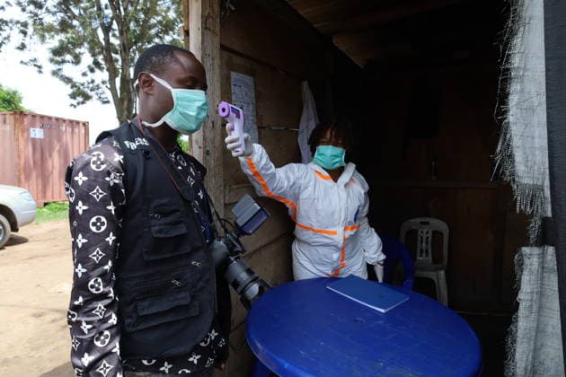 (260521) -- BUNIA, May 21, 2026 -- A medical worker checks temperature for a local journalist in Bunia, Ituri Province, the Democratic Republic of the Congo, on May 21, 2026. The outbreak, initially reported in Ituri Province, has now affected North Kivu and South Kivu, while two confirmed cases have also been reported in the neighboring country of Uganda. ( Xinhua) DR CONGO-ITURI-EBOLA OUTBREAK str 