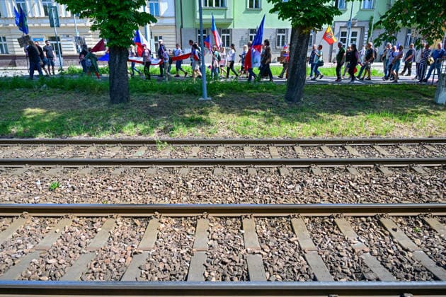A manifestation happening Nema barikada (Dumb Barricade) to express opposition to the Sudeten German Congress in Brno, Czech Republic, on May 22, 2026. In the picture, protesters are walking past the entrance to the exhibition center, where the congress will take place. (CTKxPhoto VaclavxSalek) CTKPhotoP2026052203457  CTKPhotoP2026052203457