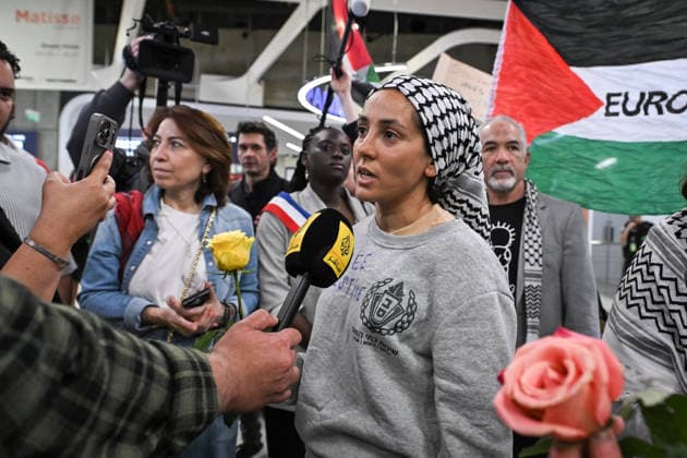 Protesters welcome returned Global Sumud Flotilla activists at Paris airport PARIS, FRANCE - MAY 22: Global Sumud Flotilla activists speak to the press upon their arrival at Charles de Gaulle Airport in Paris, France on May 22, 2026. Firas Abdullah Anadolu Paris France. Editorial use only. Please get in touch for any other usage.  Copyright: x2026xAnadoluxFirasxAbdullahx