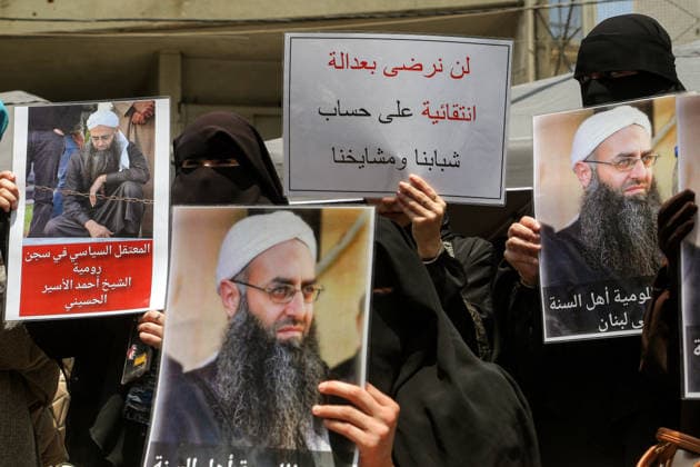 May 22, 2026, Beirut, Beirut, Lebanon: Fully veiled Sunni Muslim women display pictures of Salafist cleric Sheikh Ahmad al-Assir and a banner that reads: Ã¢â‚¬ËœÃ¢â‚¬â ¢We will not accept selective justice at the expense of our youth and clericsÃ¢â‚¬â ¢Ã¢â‚¬â ¢, during a protest demanding the release of al-Assir as well as other imprisoned Islamic detainees in a proposed General Amnesty Law. The law was stalled after supporters and families of Islamists have taken the streets to demand releases and sentence reductions, a key point of contention is whether the pardon will cover al-Assir, who was sentenced to death by a military court for 2013 and 2014 clashes with the Lebanese Armed Forces. Beirut Lebanon  - ZUMAn313 20260522_zip_n313_010 Copyright: xMarwanxNaamanix