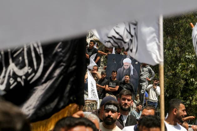 May 22, 2026, Beirut, Beirut, Lebanon: Supporters of imprisoned Islamic prisoners and Salafist cleric Ahamd al-Assir gather around his poster during a protest demanding the release and al-Assir in a proposed General Amnesty Law. The law was stalled after supporters and families of Islamists have taken the streets to demand releases and sentence reductions, a key point of contention is whether the pardon will cover al-Assir, who was sentenced to death by a military court for 2013 and 2014 clashes with the Lebanese Armed Forces. Beirut Lebanon - ZUMAn313 20260522_zip_n313_005 Copyright: xMarwanxNaamanix