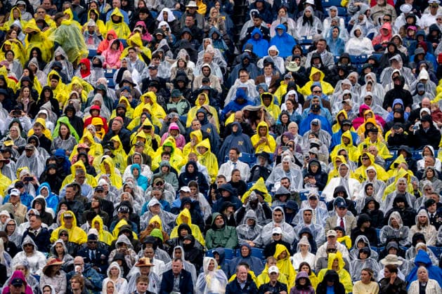 People in ponchos attend the U.S. Naval Academy Graduation and Commissioning Ceremony at the U.S. Naval Academy in Annapolis, Maryland on Friday, May 22, 2026. The Naval Academy has a total of 1059 graduates.  ANN20260522322 BONNIExCASH