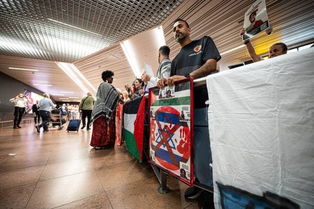 Pro-Palestinian activists pictured before Belgian activists who were part of the Gaza Flotilla arrive at Brussels Airport, in Zaventem, Friday 22 May 2026.  EMILExWINDAL 174748232