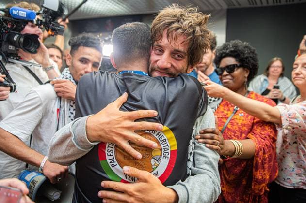 Belgian activist Isja pictured as Belgian activists who were part of the Gaza Flotilla arrive at Brussels Airport, in Zaventem, Friday 22 May 2026.  EMILExWINDAL 174748550
