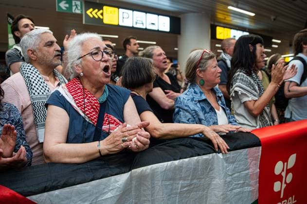Pro-Palestinian activists pictured before Belgian activists who were part of the Gaza Flotilla arrive at Brussels Airport, in Zaventem, Friday 22 May 2026.  EMILExWINDAL 174748976