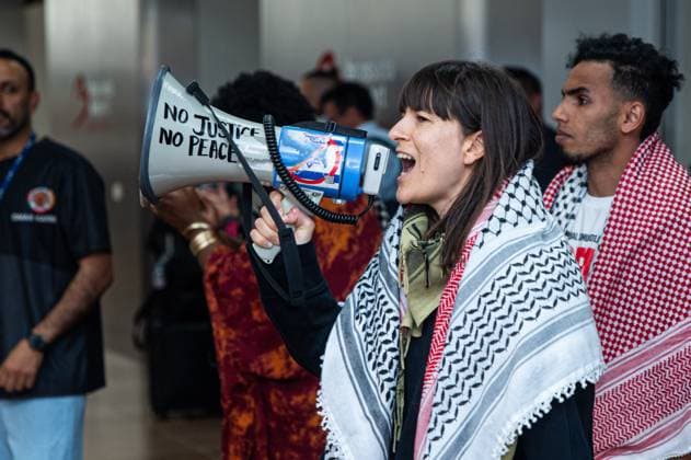 Pro-Palestinian activists pictured before Belgian activists who were part of the Gaza Flotilla arrive at Brussels Airport, in Zaventem, Friday 22 May 2026.  EMILExWINDAL 174749043