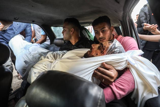 Two Palestinians were killed in Israeli attacks in Gaza GAZA CITY, GAZA, PALESTINE - MAY 22: (EDITORS NOTE: Image depicts death) Relatives of the 27-year-old Palestinian Loay Basal mourn as his body is brought to Al-Shifa Hospital following an Israeli military attack on the eastern part of Gaza City, despite the ongoing ceasefire, on May 22, 2026 in Gaza City, Gaza, Palestine. Two Palestinians were reported killed and several others injured as a result of continued Israeli strikes across the Gaza Strip. Khames Alrefi Anadolu Gaza City Gaza. Editorial use only. Please get in touch for any other usage.  Copyright: x2026xAnadoluxKhamesxAlrefix