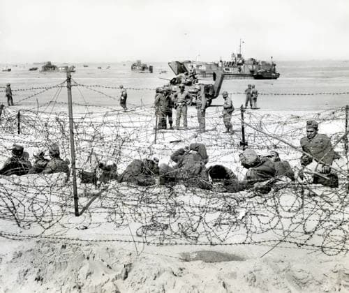 German prisoners resting in barb-wired enclosure after being interrogated by American soldiers, Utah Beach, La Madeleine, Normandy, France, Petrony, U.S. Army Signal Corps, June 6, 1944  Copyright: xCircaxImagesx ghi-circa14450