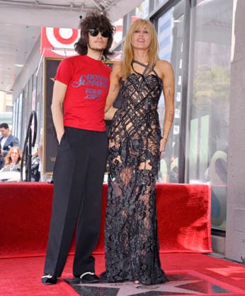 American singer, songwriter and actress Miley Cyrus (R) is joined by her fiance, musician Maxx Morando during an unveiling ceremony honoring her with the 2,845th star on the Hollywood Walk of Fame in Los Angeles on Friday, May 22, 2026.  LAP2026052216 JIMxRUYMEN