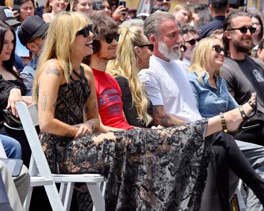 American singer, songwriter and actress Miley Cyrus reacts to comments during an unveiling ceremony honoring her with the 2,845th star on the Hollywood Walk of Fame in Los Angeles on Friday, May 22, 2026.  LAP2026052229 JIMxRUYMEN
