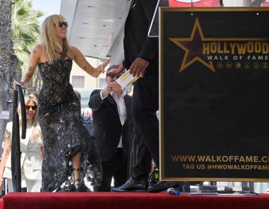 American singer, songwriter and actress Miley Cyrus is introduced during and unveiling ceremony honoring her with the 2,845th star on the Hollywood Walk of Fame in Los Angeles on Friday, May 22, 2026.  LAP2026052206 JIMxRUYMEN