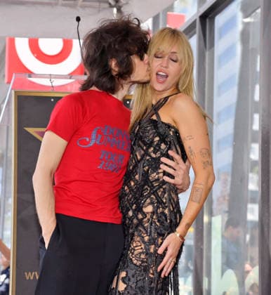 American singer, songwriter and actress Miley Cyrus (R) is joined by her fiance, musician Maxx Morando during an unveiling ceremony honoring her with the 2,845th star on the Hollywood Walk of Fame in Los Angeles on Friday, May 22, 2026.  LAP2026052222A JIMxRUYMEN