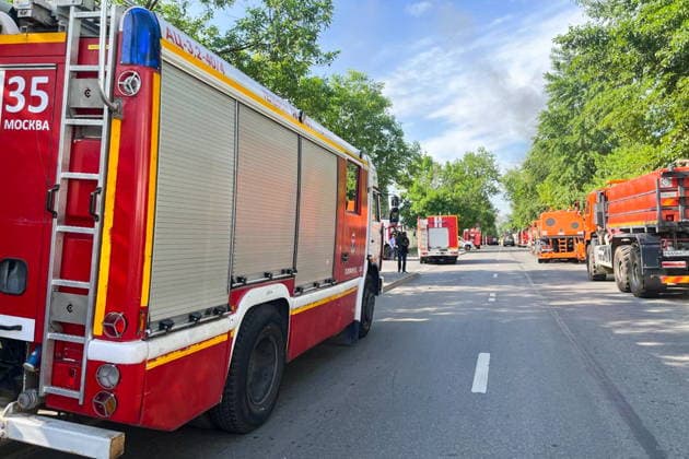 RUSSIA, MOSCOW - MAY 23, 2026: A fire truck is pictured outside a warehouse in south-eastern Moscow hit by fire. Sergei Shakhidzhanyan TASS  92905826