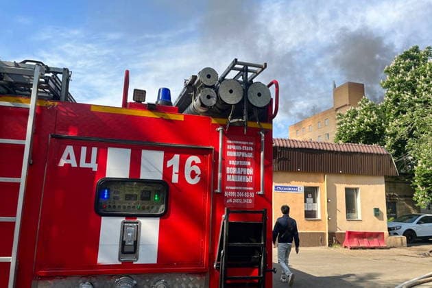 RUSSIA, MOSCOW - MAY 23, 2026: A fire truck is pictured outside a warehouse in south-eastern Moscow hit by fire. Sergei Shakhidzhanyan TASS  92905827