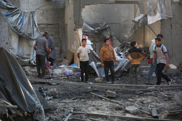 Israeli army continues attacking Gaza despite ceasefire GAZA CITY, GAZA, PALESTINE - MAY 22: Palestinians inspect the destruction amid the rubble of buildings following Israeli military strikes targeting the Abu Saif family home despite the ongoing ceasefire in Nuseirat Refugee Camp, Gaza City, Gaza, Palestine on May 22, 2026. Hassan Jedi Anadolu Gaza City Gaza. Editorial use only. Please get in touch for any other usage.  Copyright: x2026xAnadoluxHassanxJedix
