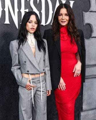 Netflix FYSEE LA - Wednesday Season 2 ATAS Emmy FYC Event HOLLYWOOD, LOS ANGELES, CALIFORNIA, USA - MAY 22: American actress Jenna Ortega wearing McQueen Pre Fall 2026, styled by Enrique Melendez and Welsh actress Catherine Zeta-Jones wearing Magda Butrym arrive at the Netflix FYSEE LA - Wednesday Season 2 ATAS (Academy of Television Arts and Sciences) Emmy FYC (For Your Consideration) Event held at the Hollywood Forever Cemetery on May 22, 2026 in Hollywood, Los Angeles, California, United States. Hollywood Hollywood Forever Cemetery California United States Copyright: xXavierxCollin ImagexPressxAgencyx
