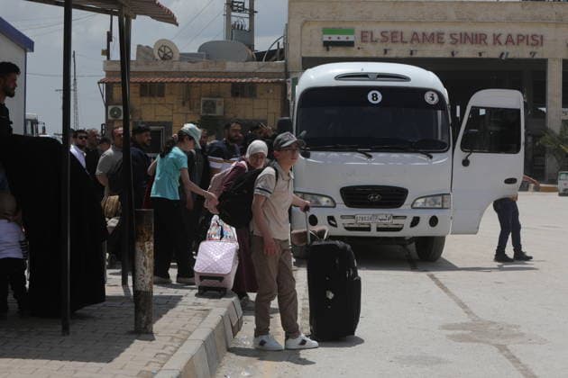 Syrian citizens create heavy congestion at border gates ahead of Eid al-Adha ALEPPO, SYRIA - MAY 23: Syrian citizens, who have been living in Turkiye for many years, cause heavy congestion at the border gates as they head back to their home country to spend the upcoming Eid al-Adha, in Bab al-Salam border crossing of Azaz, Aleppo, Syria on May 23, 2026. It is reported that approximately 2,000 people cross into Syria daily through Oncupinar, while similar crowds and intensive activity are observed at the Bab al-Salameh (Elsalame) Border Gate on the Syrian side. Bakr Al Kasem Anadolu Aleppo Syria. Editorial use only. Please get in touch for any other usage.  Copyright: x2026xAnadoluxBakrxAlxKasemx