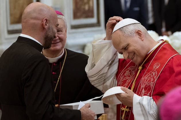 May 23, 2026, Acerra, Napoli, Italy: The Pope seen receiving a new skullcap from religious personnel. Pope Leo XIV visited Acerra for his patroral itinerary. He was the first Pope to visit the Land of Fires, a region affected by illegal dumping and burning of toxic waste in Campania region in Italy and meet families of victims of pollution in the Cathedral of Santa Maria Assunta in Acerra. Acerra Italy - ZUMAf172 20260523_zip_f172_041 Copyright: xValeriaxFerrarox